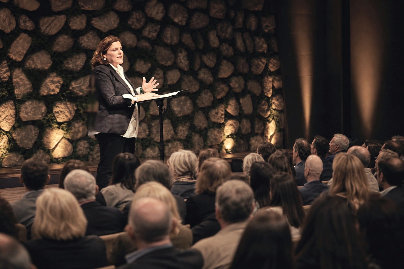 Sophie McLean speaking to a full room