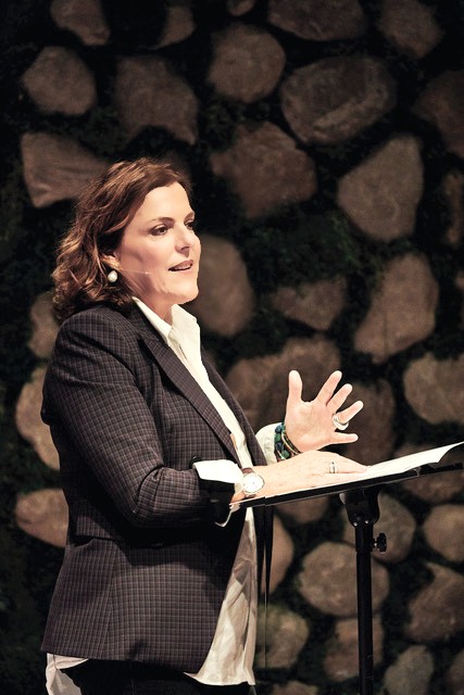 Sophie McLean leading a seminar on stage